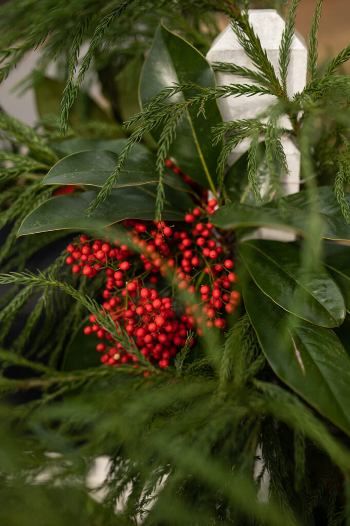 close up view of mailbox decorated with evergreens